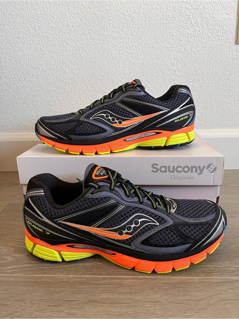 Saucony Black Running Shoes with Orange and Neon Yellow Accents